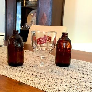 Bundle of vintage Schlitz beer bottles and glass